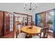 Elegant dining room featuring a wooden table, classic chairs, and doors opening to the living area at 606 1St W St, Conover, NC 28613