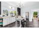Modern kitchen featuring white cabinets, butcher block countertops, and a stylish island with seating at 606 1St W St, Conover, NC 28613