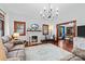 Inviting living room with a decorative fireplace, hardwood floors, and a vintage-style chandelier at 606 1St W St, Conover, NC 28613