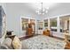 Spacious living room with hardwood floors, neutral decor, and ample natural light from large windows at 606 1St W St, Conover, NC 28613