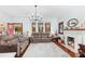Bright living room featuring a fireplace, hardwood floors, and large windows for plenty of natural light at 606 1St W St, Conover, NC 28613