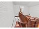 Wooden staircase with white walls, wooden railings leading to an upstairs room with hardwood floors at 606 1St W St, Conover, NC 28613