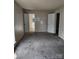 A spacious bedroom with neutral walls and carpeted floors at 7107 Stonington Ln, Charlotte, NC 28227