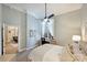 Bedroom featuring a work space, neutral colors, a ceiling fan, and a window with curtains at 718 W Trade St # 105, Charlotte, NC 28202