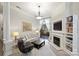 Spacious living room with fireplace, built-in shelves and an open layout with balcony access at 718 W Trade St # 105, Charlotte, NC 28202