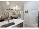 Open floorplan flows from a well appointed kitchen to a spacious living room at 718 W Trade St # 105, Charlotte, NC 28202