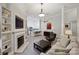 Comfortable living room with fireplace, built-in shelves, and an open layout with kitchen view at 718 W Trade St # 105, Charlotte, NC 28202