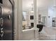Inviting living room featuring a fireplace, built-in shelves, and stylish architectural columns near the front door at 718 W Trade St # 105, Charlotte, NC 28202