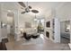 Open living space with fireplace, built-in shelves, a ceiling fan and a sliding door to the balcony at 718 W Trade St # 105, Charlotte, NC 28202