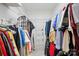 Walk-in closet with metal shelving and rods, offering ample storage space for clothing at 7725 Whitmire Ln, Mint Hill, NC 28227