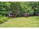 A well-manicured front lawn leads to a home with a charming covered porch at 7725 Whitmire Ln, Mint Hill, NC 28227