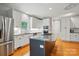 Bright kitchen with white cabinets, stainless steel appliances, and a center island at 7725 Whitmire Ln, Mint Hill, NC 28227
