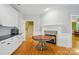 Spacious eat in kitchen featuring a fireplace and hardwood floors at 7725 Whitmire Ln, Mint Hill, NC 28227