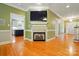 Living room featuring a fireplace and view into the kitchen at 7725 Whitmire Ln, Mint Hill, NC 28227