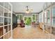 The sunroom is bright and airy with multiple windows and tiled floors at 7725 Whitmire Ln, Mint Hill, NC 28227