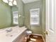 Cozy bathroom with modern fixtures, a spacious vanity, and hardwood flooring at 8218 Houston Ridge Rd, Charlotte, NC 28277
