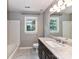 Bathroom featuring a modern vanity, updated fixtures, and tile flooring at 8218 Houston Ridge Rd, Charlotte, NC 28277