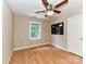 A cozy bedroom features hardwood floors, neutral walls, and a ceiling fan at 8218 Houston Ridge Rd, Charlotte, NC 28277