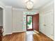 Welcoming foyer with hardwood floors, stained glass sidelights, and a view of the front yard at 8218 Houston Ridge Rd, Charlotte, NC 28277