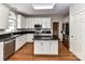 Modern kitchen featuring white cabinetry, granite countertops, stainless steel appliances and a central island at 8218 Houston Ridge Rd, Charlotte, NC 28277
