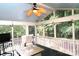 Relaxing screened-in porch with ceiling fan, comfortable seating, and views of the lush surroundings at 8218 Houston Ridge Rd, Charlotte, NC 28277