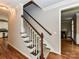Staircase with hardwood and carpeted steps lead to the upper level at 8218 Houston Ridge Rd, Charlotte, NC 28277
