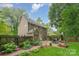 Secluded backyard with patio, seating area, and lush landscaping at 8624 Canter Post Dr, Charlotte, NC 28216