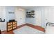 Cozy bedroom with wood floors, a woven chest of drawers, shelving, and natural light at 8624 Canter Post Dr, Charlotte, NC 28216