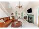 Inviting living room with a fireplace, large sofa, and bright windows at 8624 Canter Post Dr, Charlotte, NC 28216