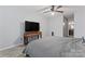 Bedroom features a gray quilt bed, a ceiling fan, and a bright window at 945 Heritage Pkwy, Fort Mill, SC 29715