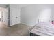 The bedroom features a gray quilt bed, white doors, and a neutral carpet at 945 Heritage Pkwy, Fort Mill, SC 29715