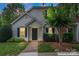 Charming home featuring a well-maintained lawn, a black door, and tasteful shrubbery at 945 Heritage Pkwy, Fort Mill, SC 29715