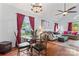 Cozy living room and dining area combo offers ample natural light, comfortable seating and easy access to the kitchen at 945 Heritage Pkwy, Fort Mill, SC 29715