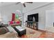 Comfortable living room features high ceilings, large TV, and seamless access to outdoor area at 945 Heritage Pkwy, Fort Mill, SC 29715