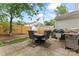 Outdoor patio featuring stone pavers, wood fence, and an outdoor table set, perfect for entertaining at 945 Heritage Pkwy, Fort Mill, SC 29715
