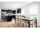 Open floorplan shows a kitchen with an island and dining area at 10124 Florentine Way, Charlotte, NC 28214