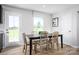 Bright dining room with wood floors, a large window and a table for six at 10124 Florentine Way, Charlotte, NC 28214