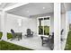Covered patio featuring comfortable chairs, offering a relaxing outdoor space with a view of the surrounding landscape at 10124 Florentine Way, Charlotte, NC 28214