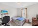 This bedroom features a bed, desk with computer, neutral walls, and a window with curtains at 1023 Valley Ridge Rd, Charlotte, NC 28214