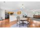 Open kitchen and dining area with wooden cabinets and stainless steel appliances offering seamless living at 1023 Valley Ridge Rd, Charlotte, NC 28214