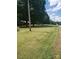 A large, well-maintained lawn with mature trees provides a picturesque and inviting outdoor space at 10500 Bethel Church Rd, Midland, NC 28107