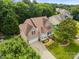 Aerial view of home surrounded by mature trees, showcasing its location within a peaceful residential area at 10703 Back Ridge Rd, Charlotte, NC 28277