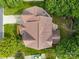 Top-down aerial view of a well-maintained property with a detailed roof and lush landscaping at 10703 Back Ridge Rd, Charlotte, NC 28277