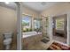 Bright bathroom featuring a soaking tub, frameless shower, and natural light at 10703 Back Ridge Rd, Charlotte, NC 28277