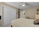 Bright bedroom with large closet, ceiling fan, and ensuite bathroom access at 10703 Back Ridge Rd, Charlotte, NC 28277