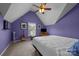 Spacious bedroom with sloped ceilings and a comfortable queen size bed, great for relaxation at 10703 Back Ridge Rd, Charlotte, NC 28277