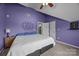 Comfortable bedroom featuring sloped ceilings, ceiling fan, and space for relaxation and sleep at 10703 Back Ridge Rd, Charlotte, NC 28277
