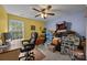 Bedroom featuring large window, ceiling fan, and space for office with added storage at 10703 Back Ridge Rd, Charlotte, NC 28277