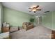 Spacious bonus room featuring comfortable seating, a ceiling fan and plenty of open space at 10703 Back Ridge Rd, Charlotte, NC 28277