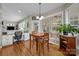 Bright breakfast nook with hardwood floors, built-in desk, and a window view at 10703 Back Ridge Rd, Charlotte, NC 28277